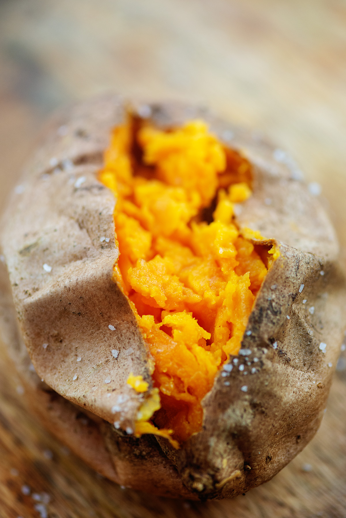 A close up of a split open sweet potato.