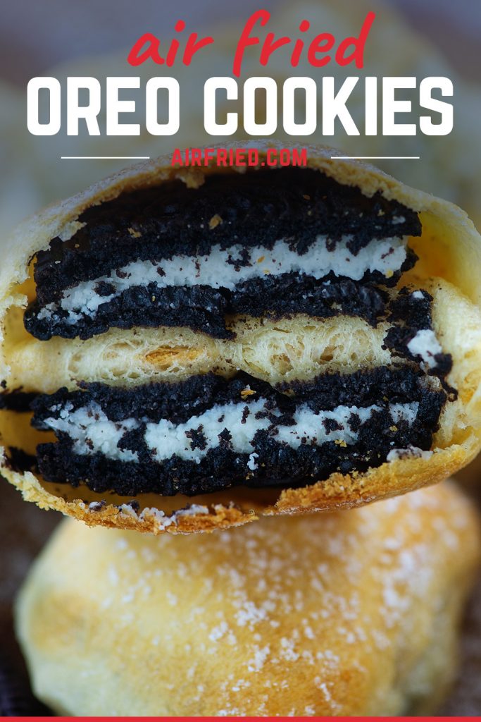 A close up of a fried oreo cut in half on top of another fried oreo.