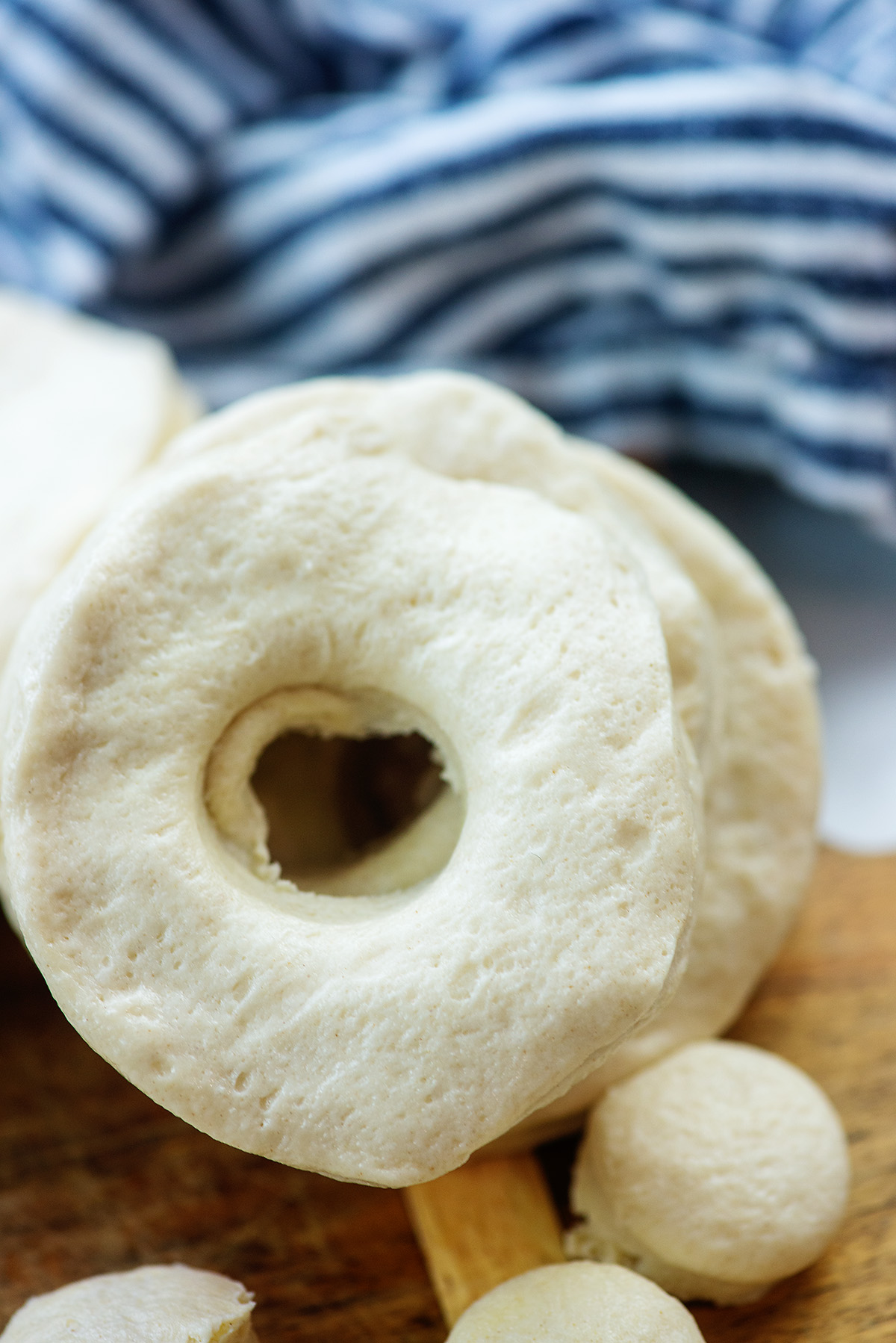 A close up of biscuit dough shapped like a donut