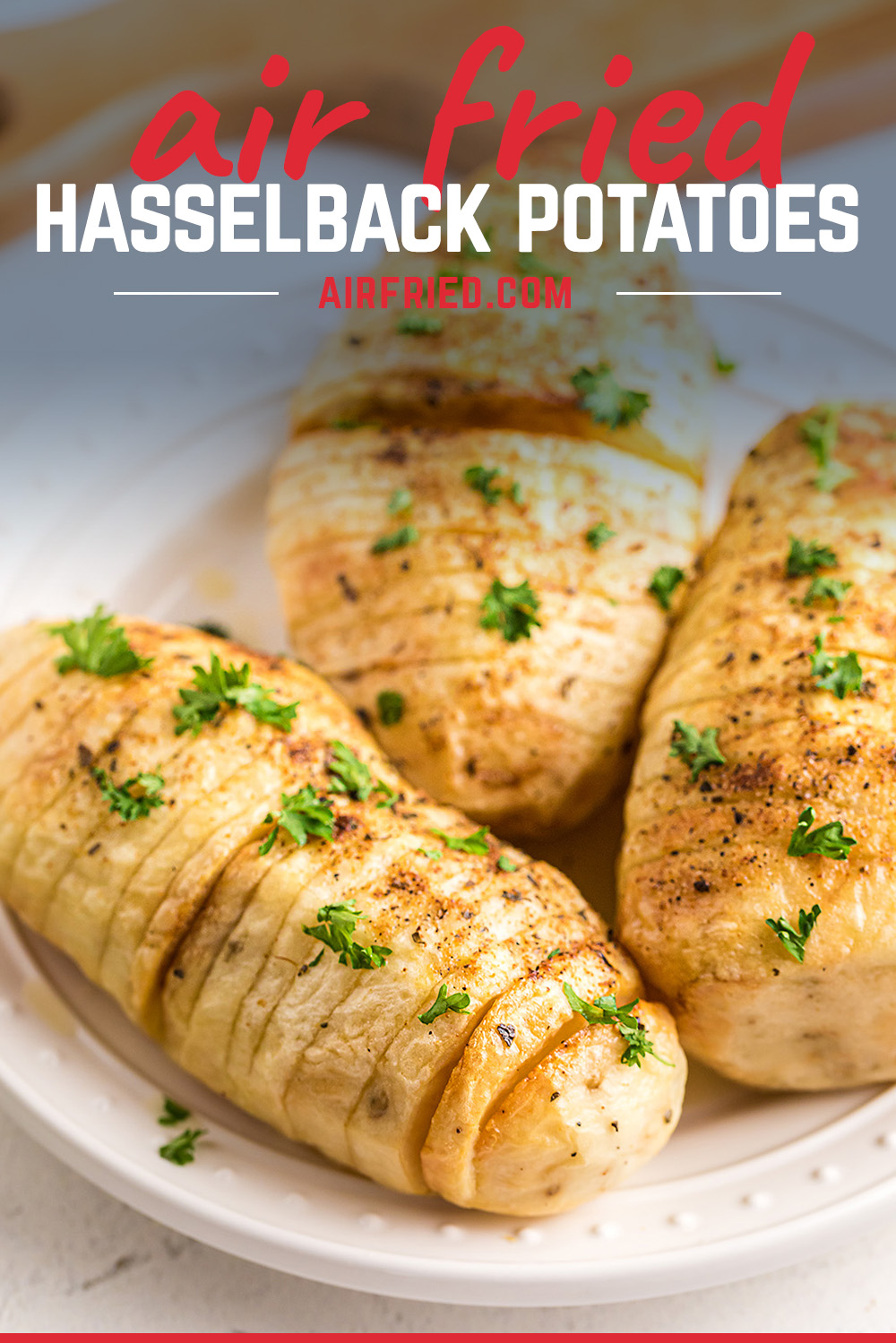 One of the best ways to eat a potato! Air fryer hasselback potatoes - ready so quickly and super easy! #Hasselback #potatoes #airfryer