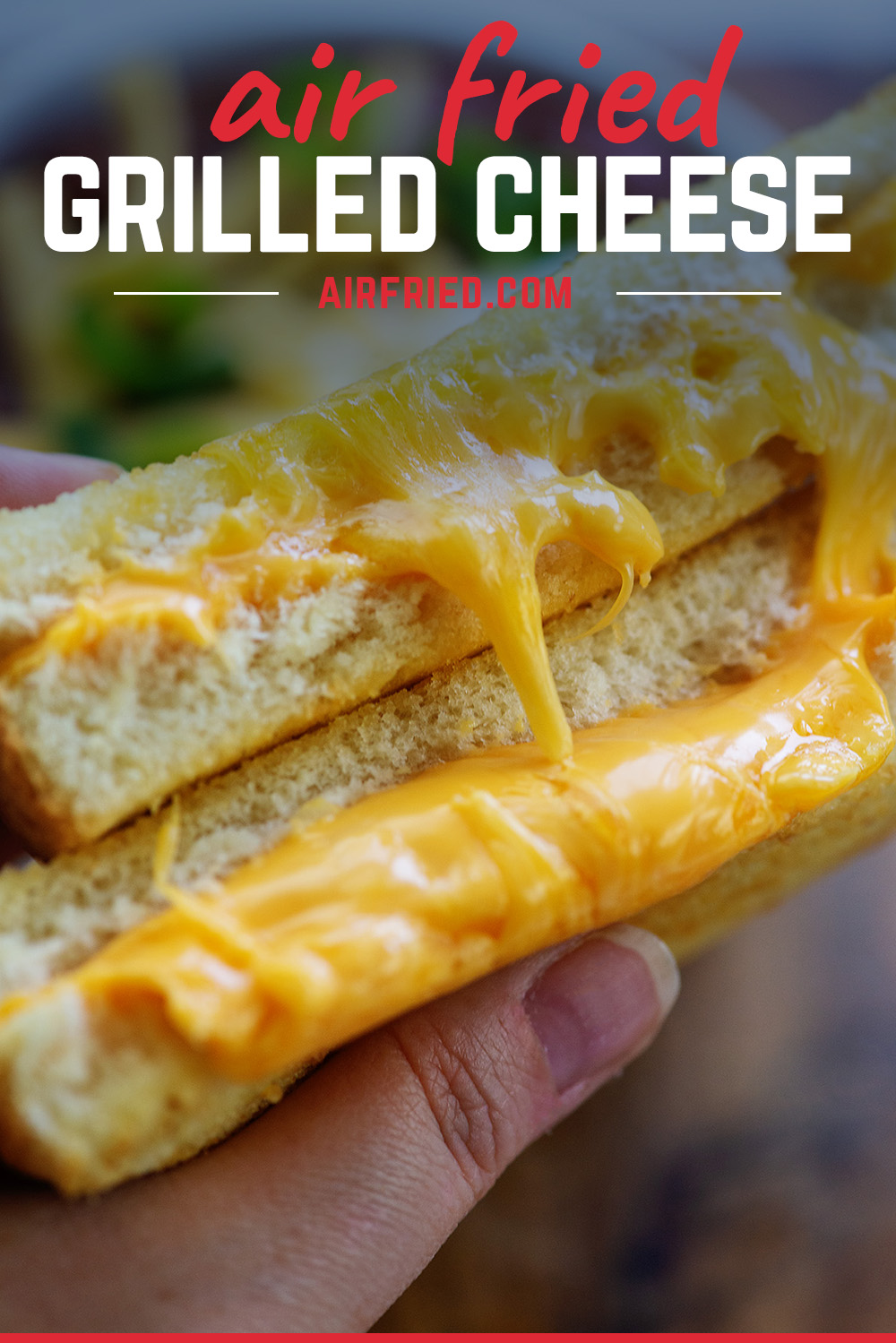 extra cheesy grilled cheese sandwich cut in half