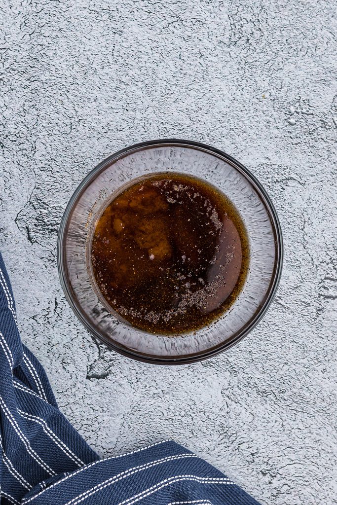 Overhead view of maple bourbon glaze in a glass bowl.