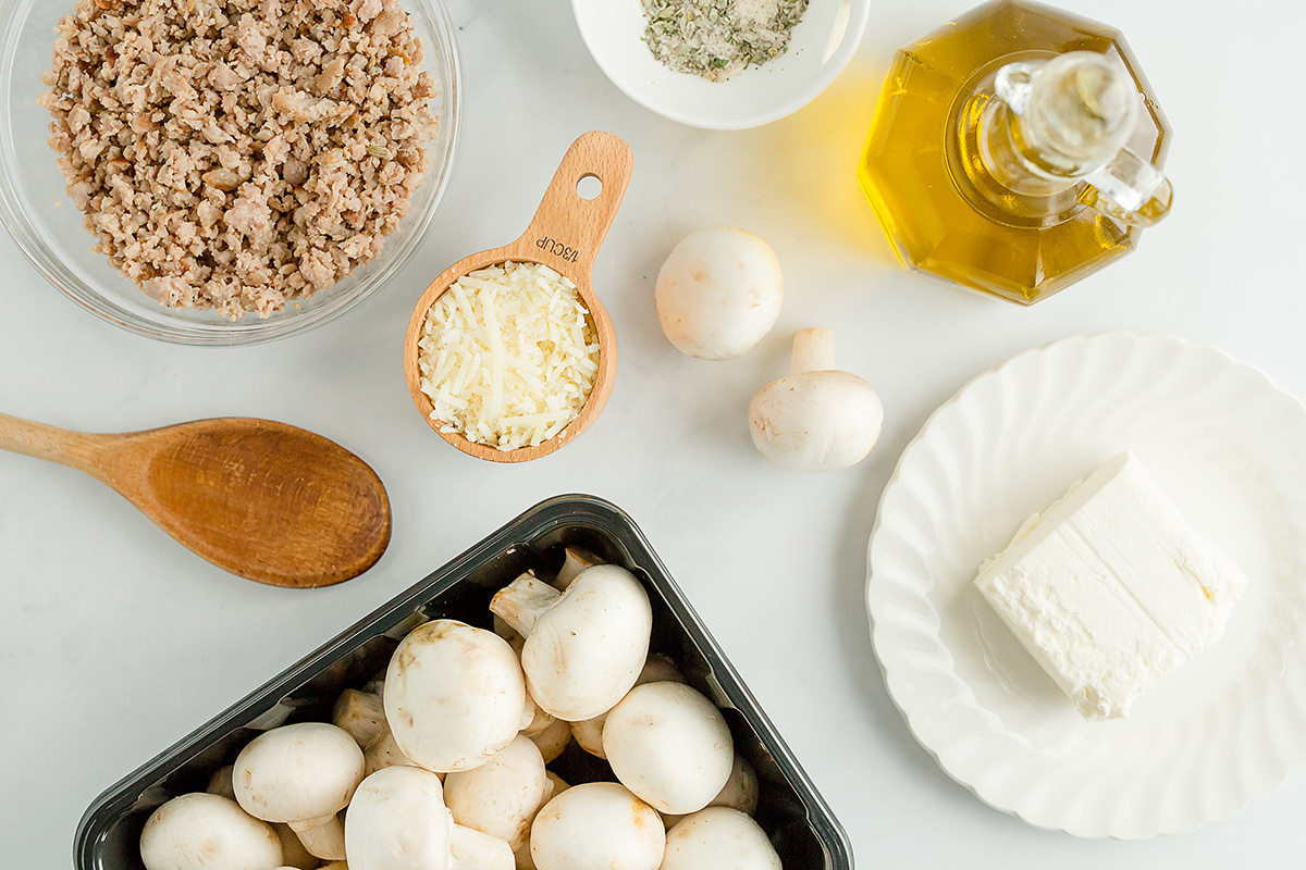 ingredients for stuffed mushrooms spread out on a counter