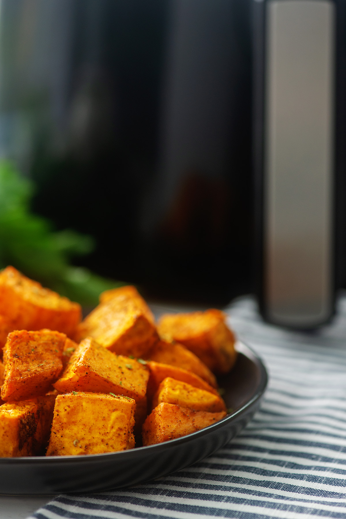 Side view of sweet potato cubes on a plate.