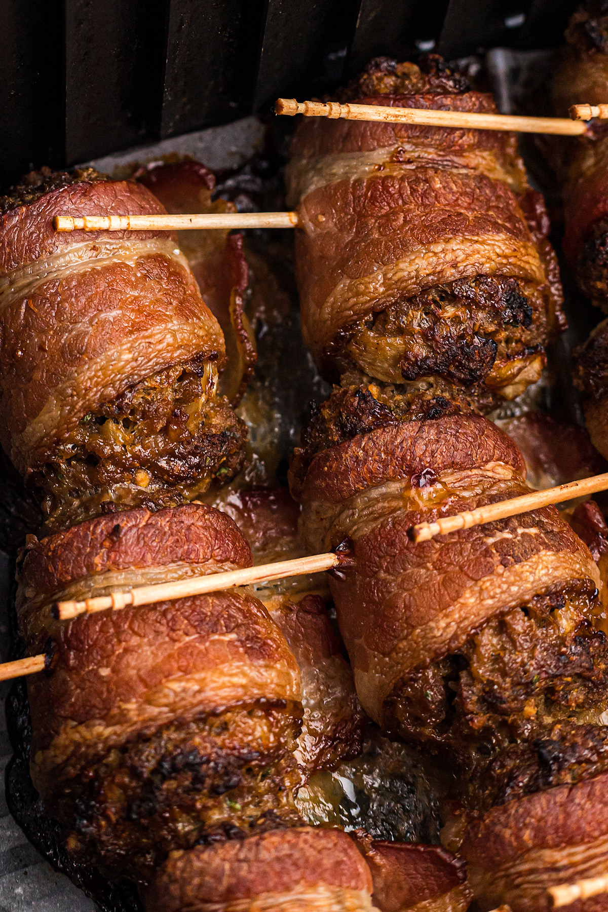 meatballs wrapped in bacon with toothpicks.