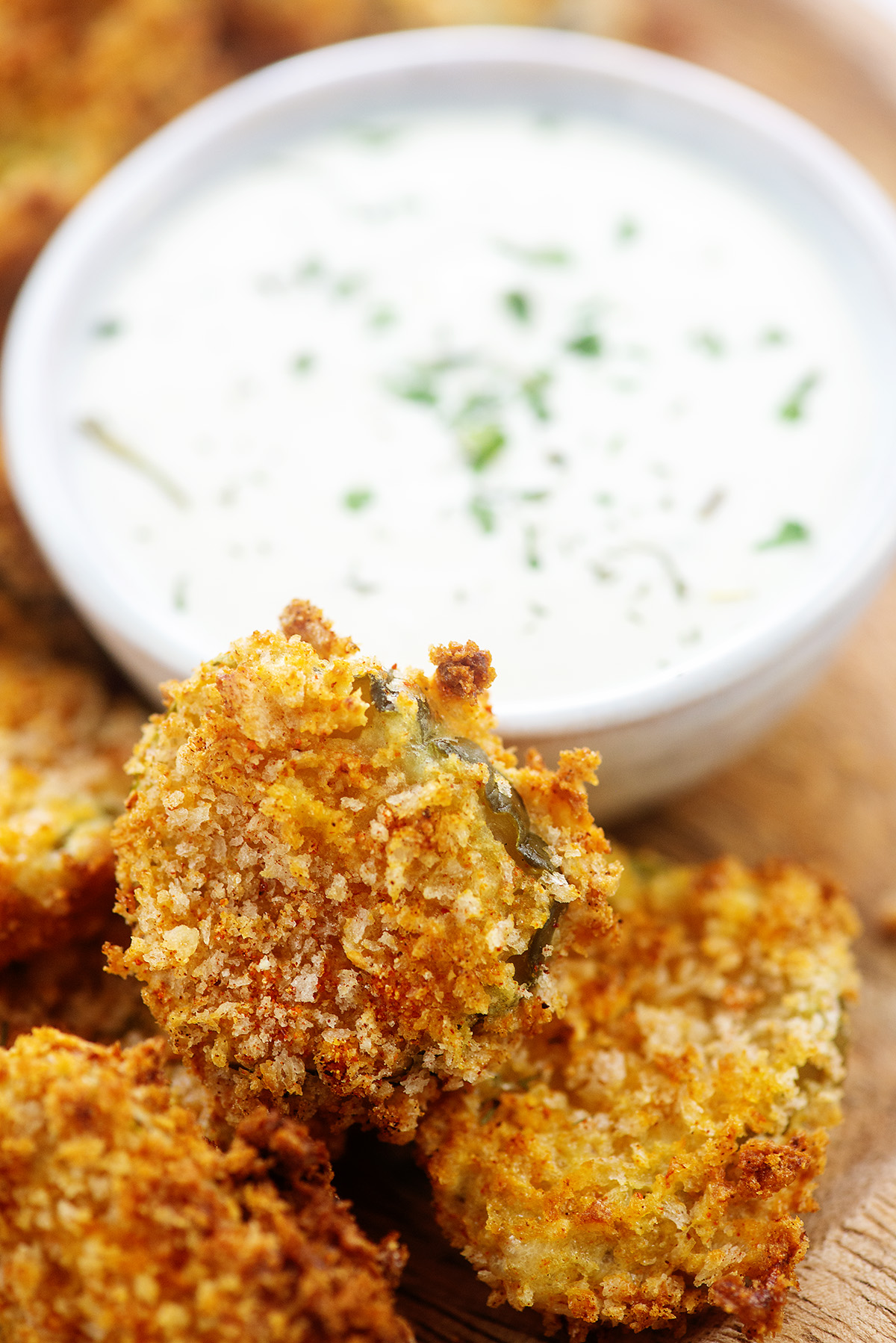 crispy fried pickles next to ranch dip.