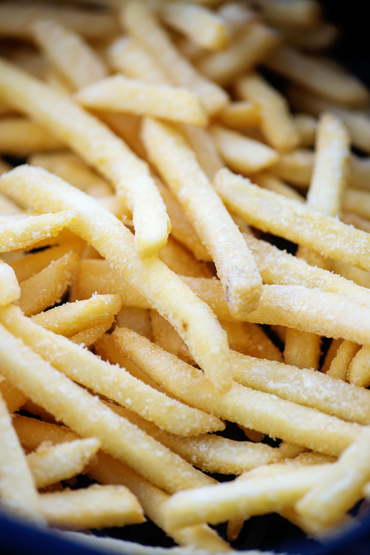 Closeup of frozen french fries in a pile