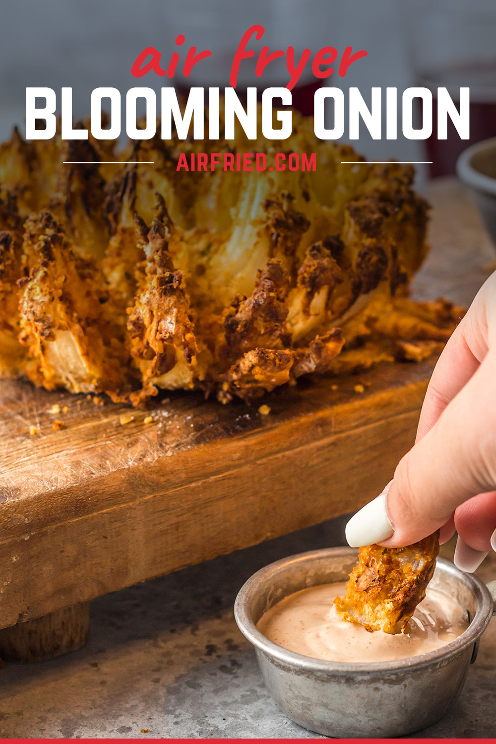 Blooming onions from the air fryer are crispy and delicious!  Try them in our homemade dipping sauce!  #recipes #appetizers #airfried