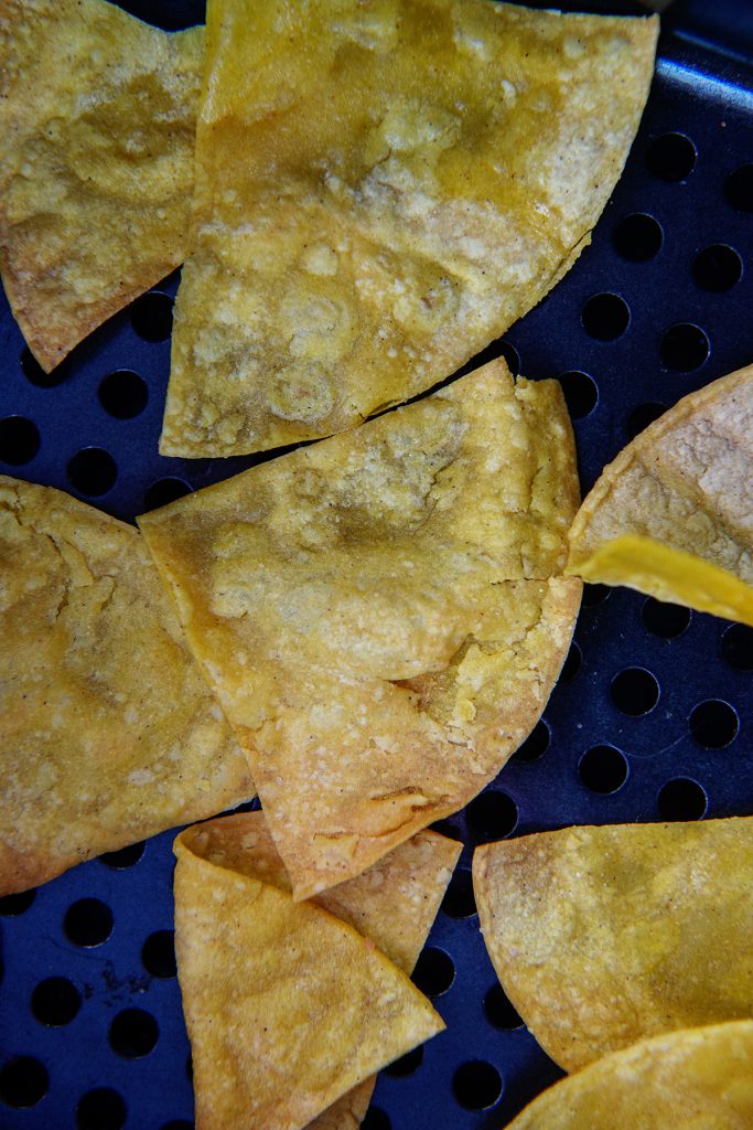 Overhead view of chips in an air fryer basket