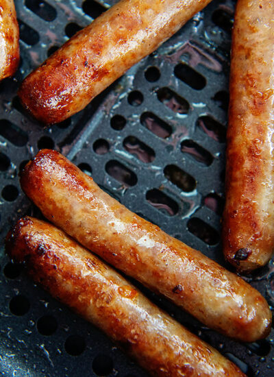 Close up of cooked sausage links in an air fryer