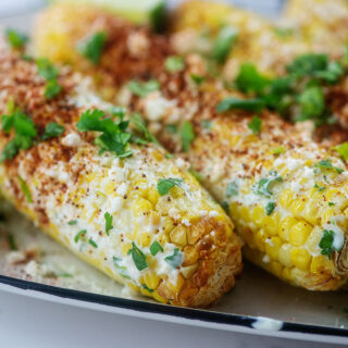 street corn on a serving tray