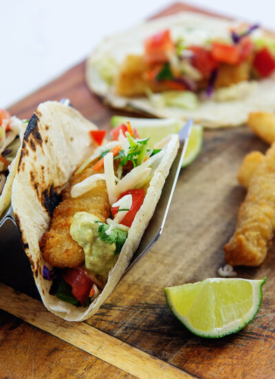 Fish tacos on a wooden cutting board
