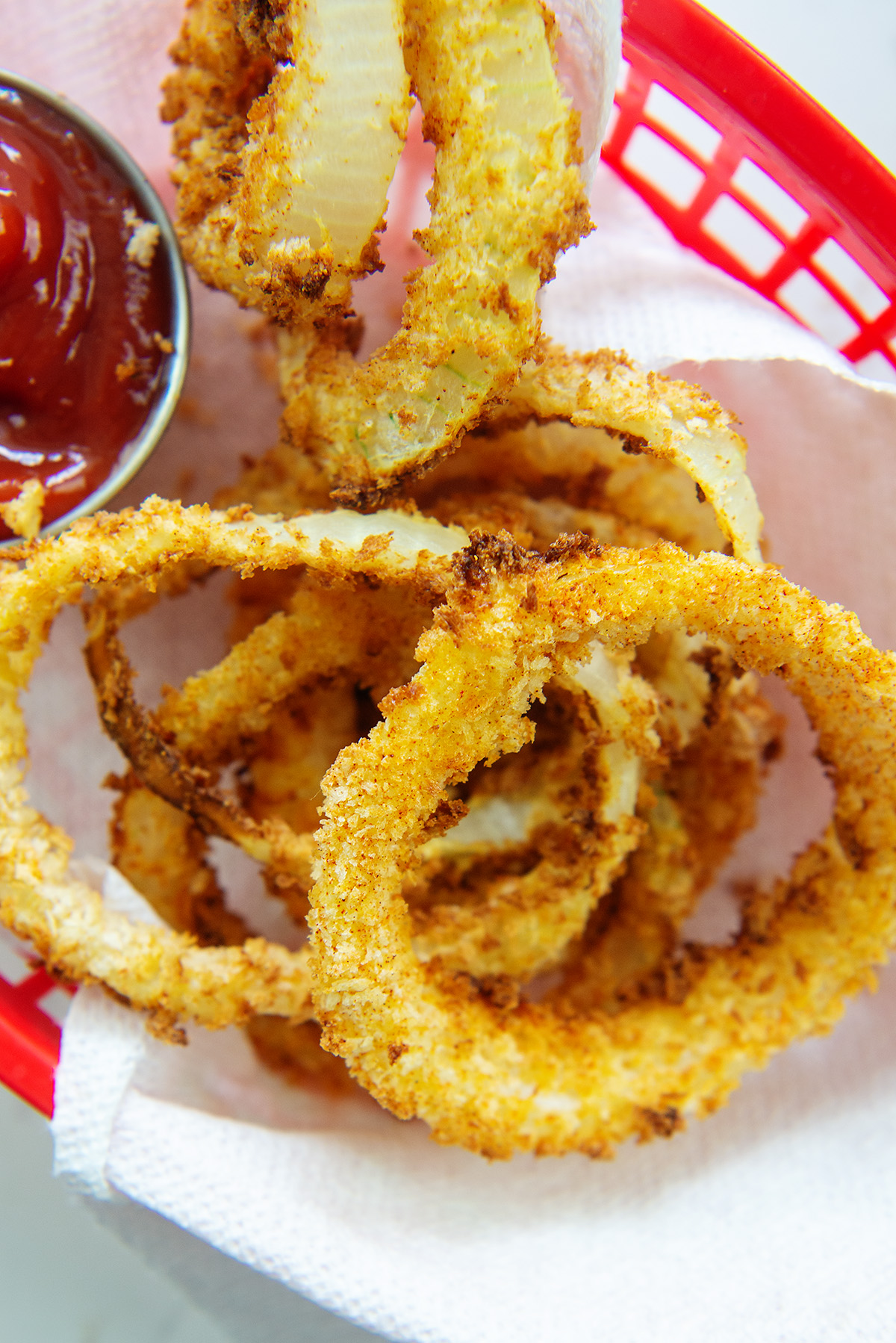 Close up of onion rings in an appetizer basket