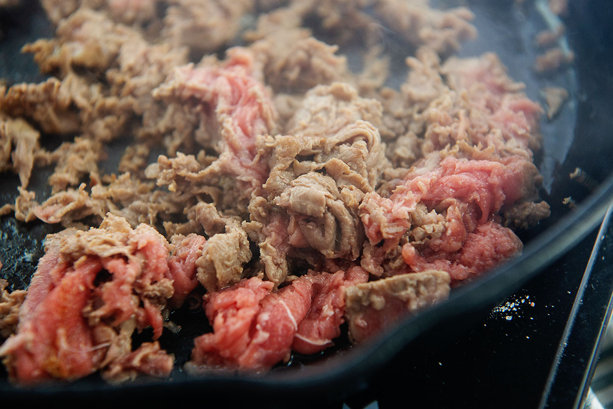 Beef cooking in a skillet