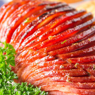 Close up of garnished sliced ham.