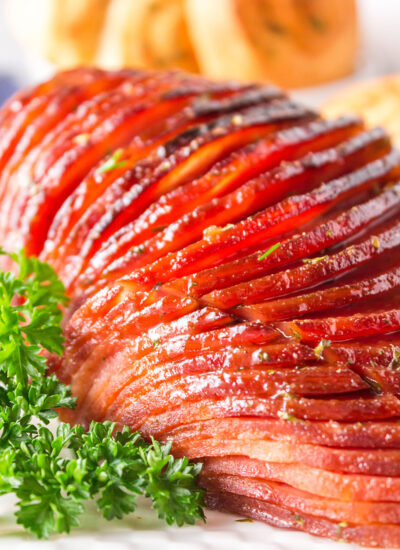 Close up of garnished sliced ham.