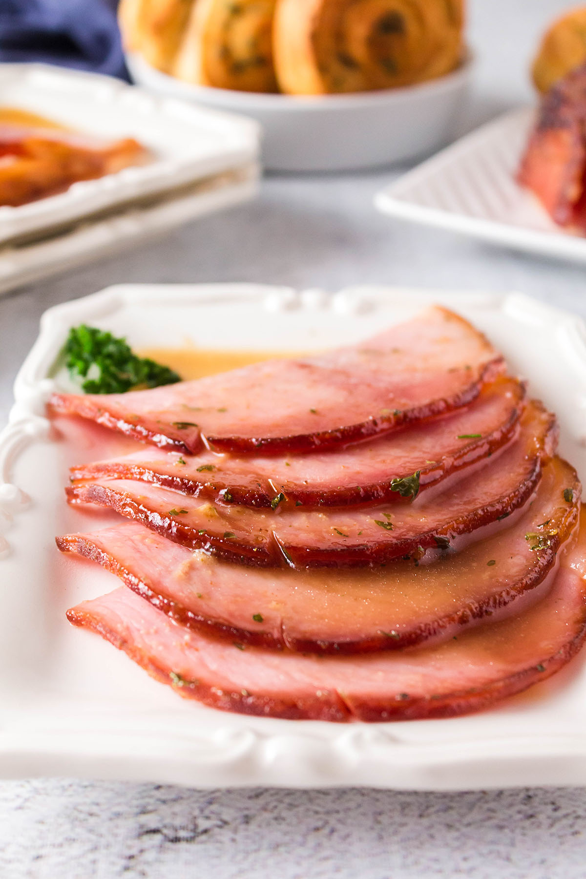 Close up of a few pieces of sliced ham.