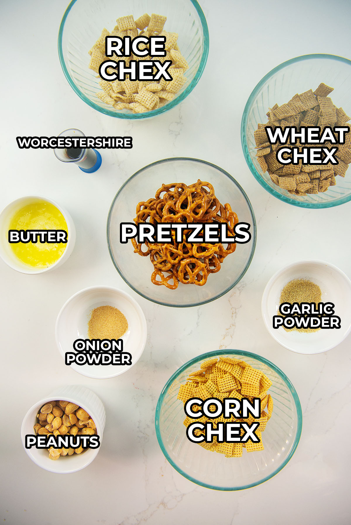 Chex mix ingredients spread out on a countertop.