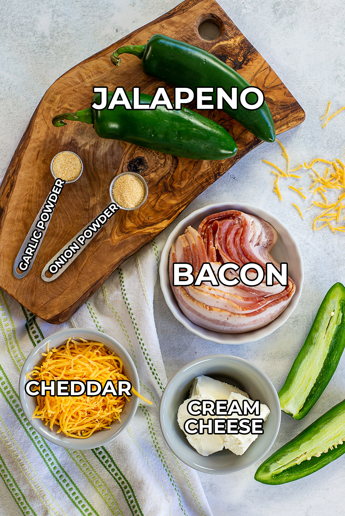 Ingredients for jalapeno poppers spread on a counter.