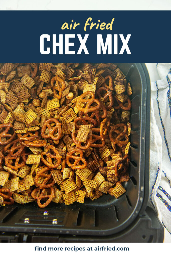 Close up of cooked chex mix in an air fryer basket.