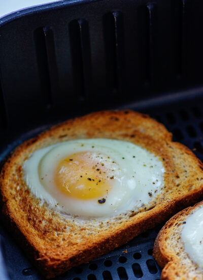 egg cooked in slice of bread in the air fryer.