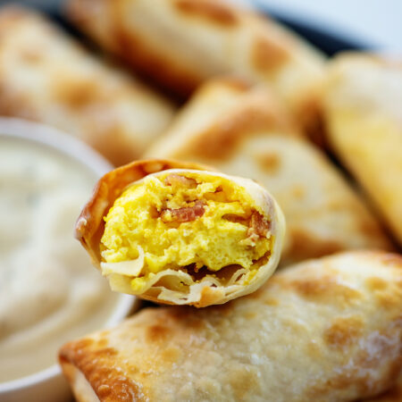Stacked egg rolls up close.