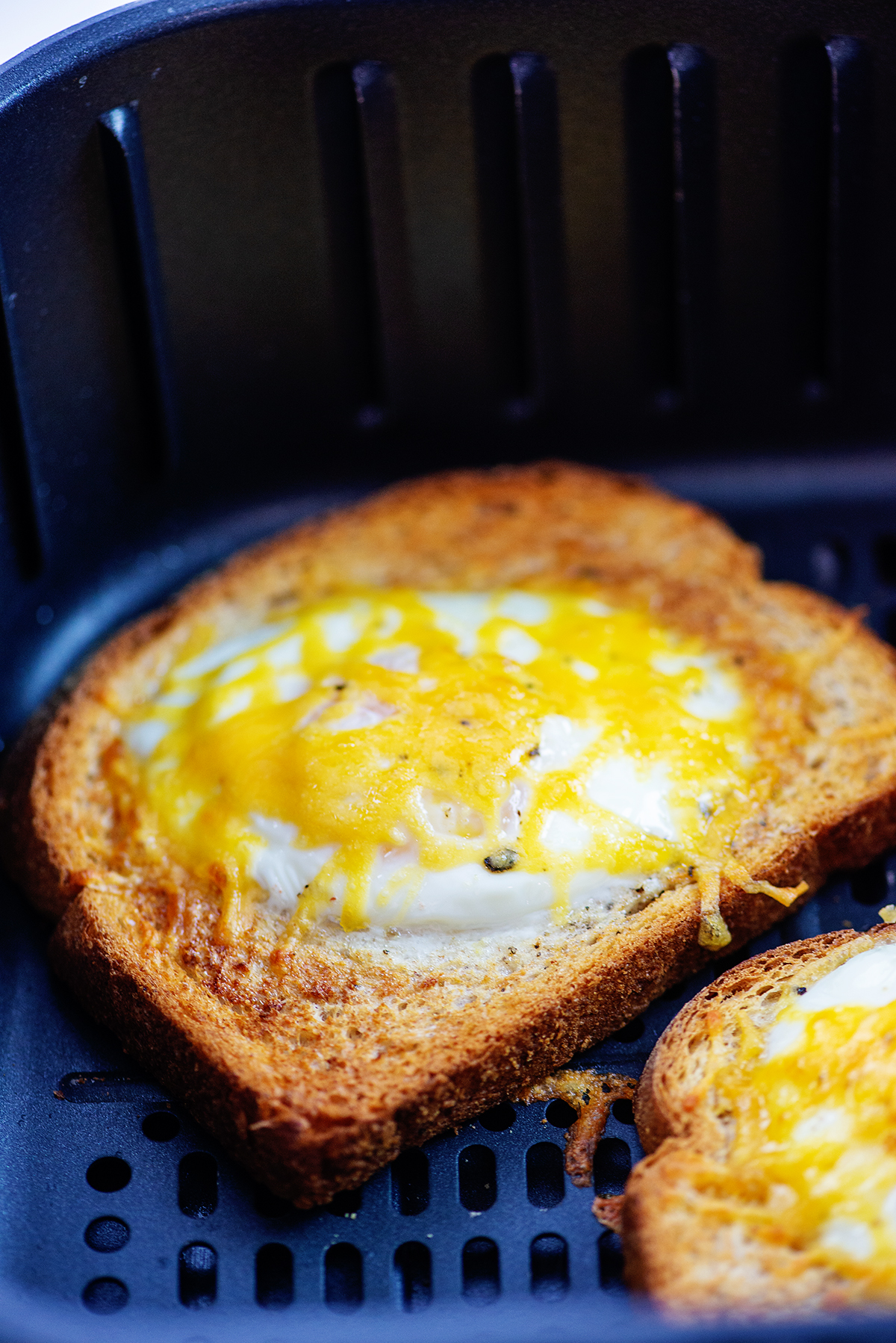 egg toast in air fryer basket.