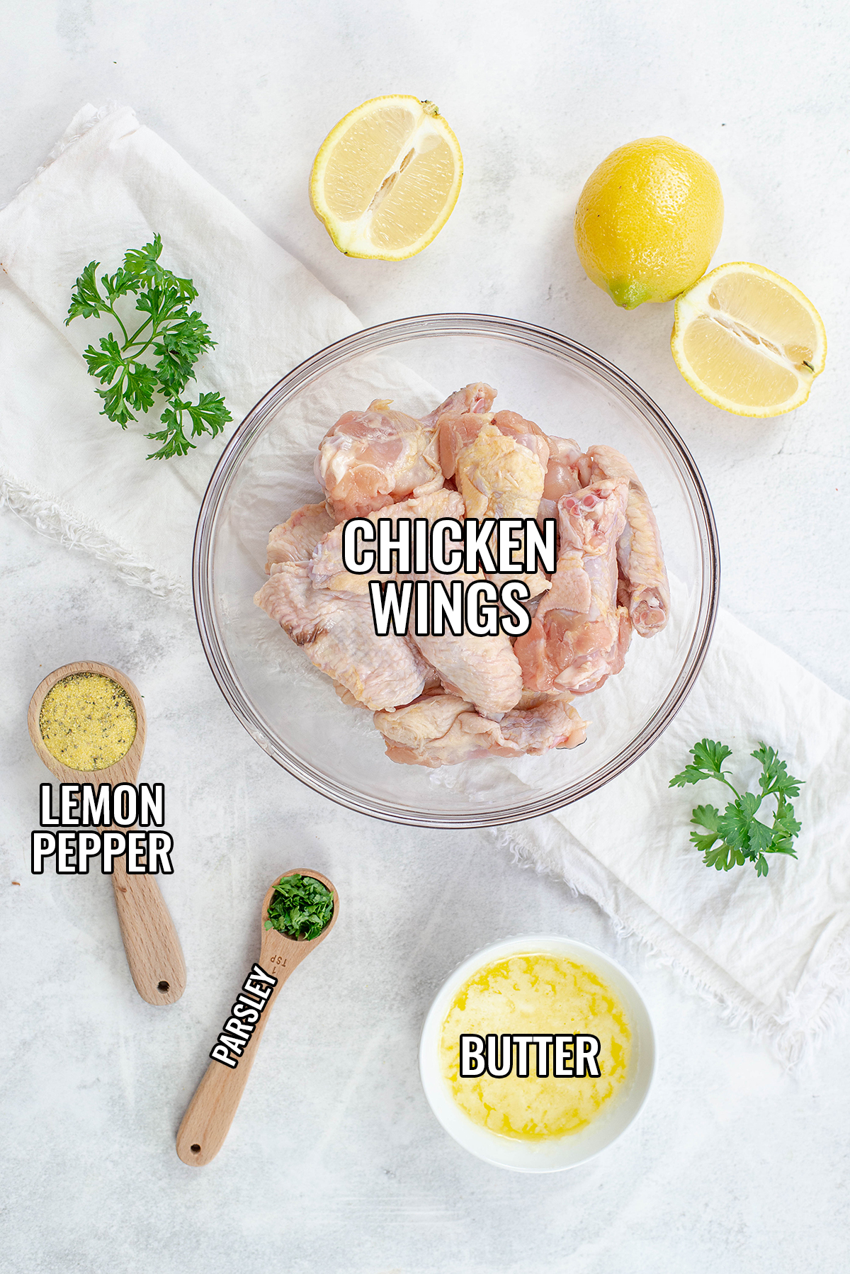 Lemon pepper chicken wing ingredients spread out on a counter.