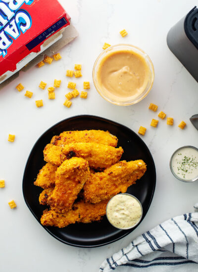 Overhead view of captain crunch cereal next to some chicken strips.