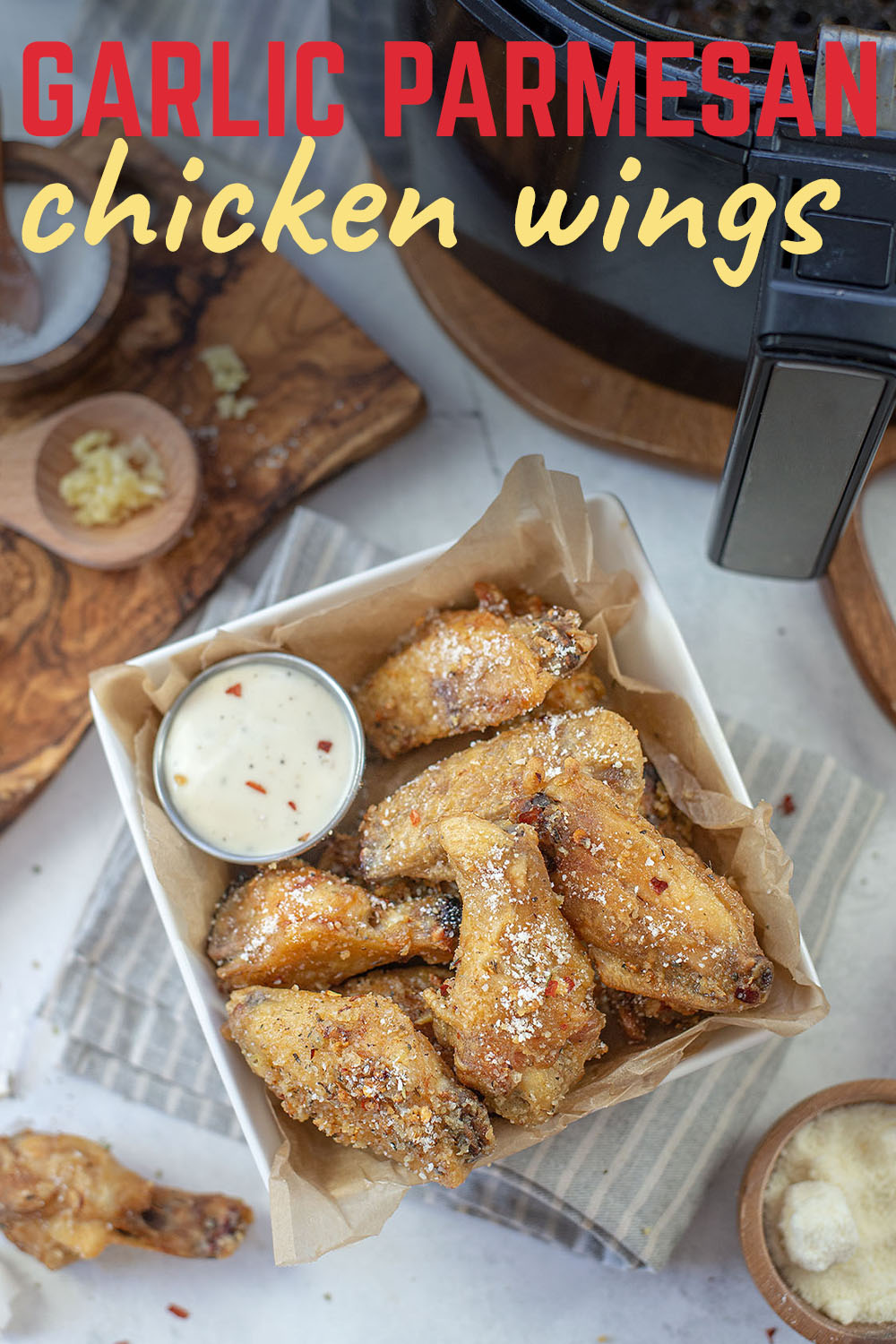 These air fryer chicken wings are tossed in our homemade Garlic Parmesan Sauce - rich, buttery, and so much garlic!