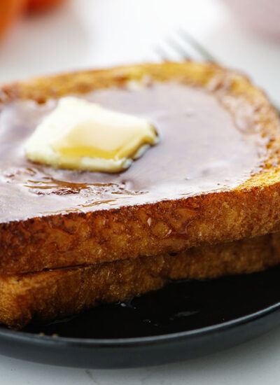 Close up of two slices of French toast.