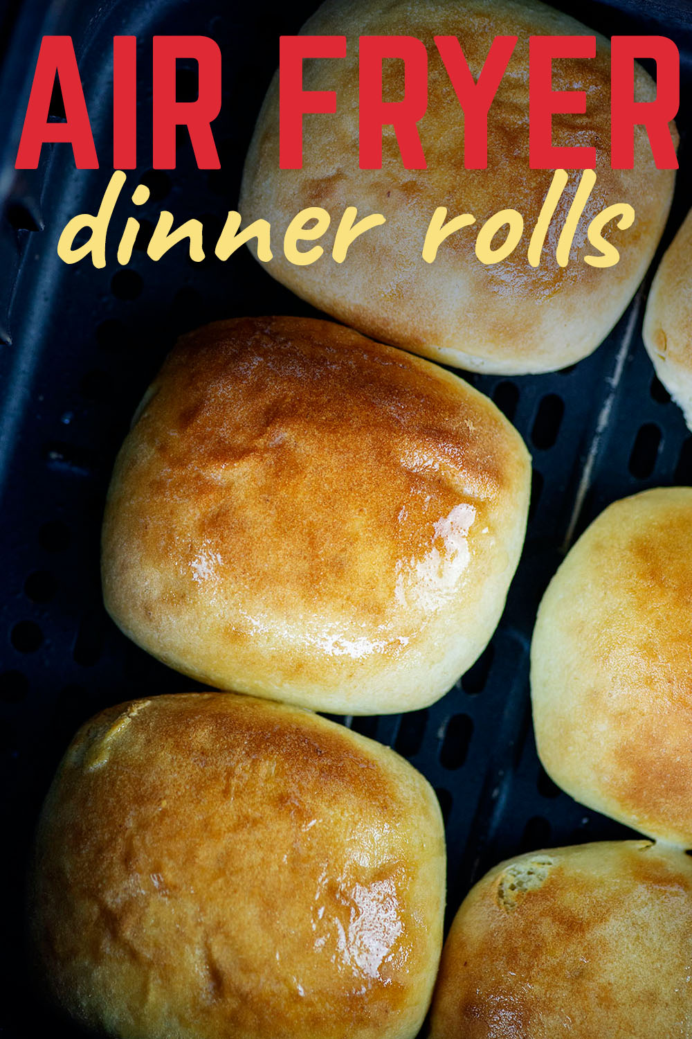 Overhead view of dinner rolls in an air fryer.