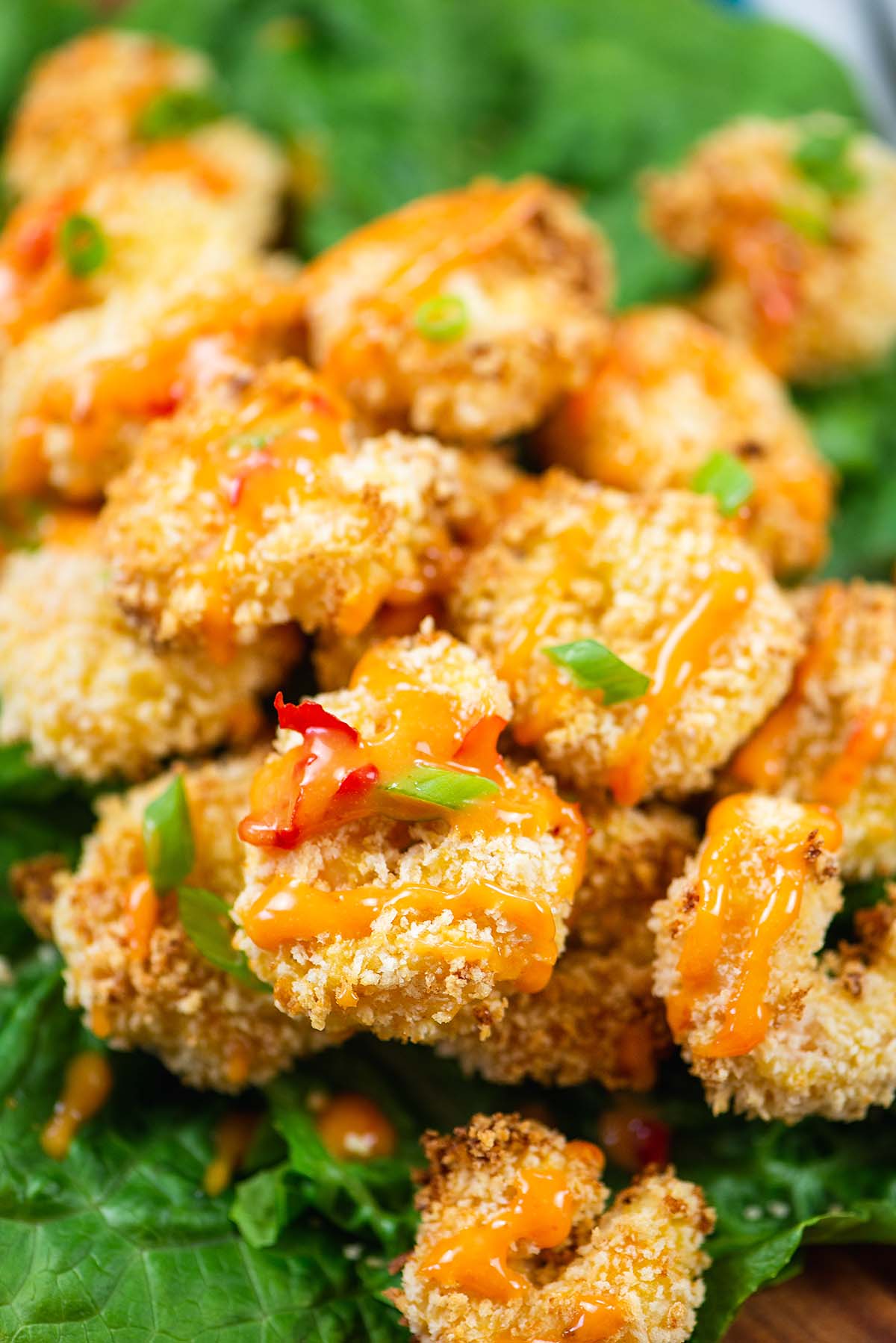 Close up of shrimp with bang bang sauce on it.