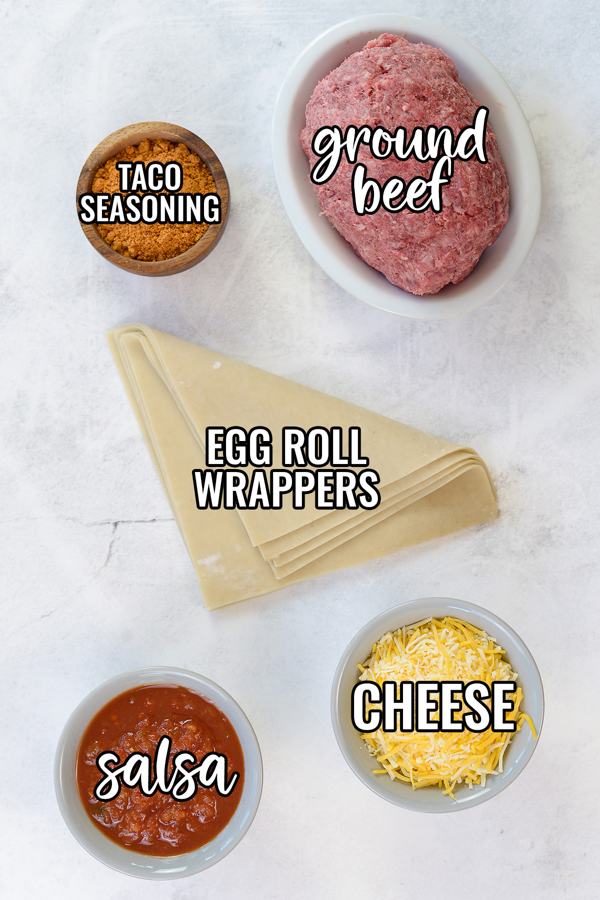 Taco egg roll ingredients spread out on a countertop.