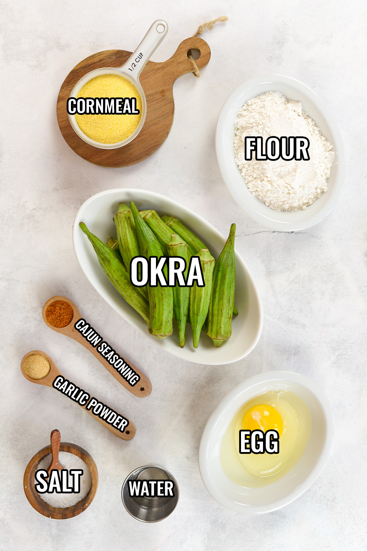 Ingredients for air fryer okra spread out on a counter.