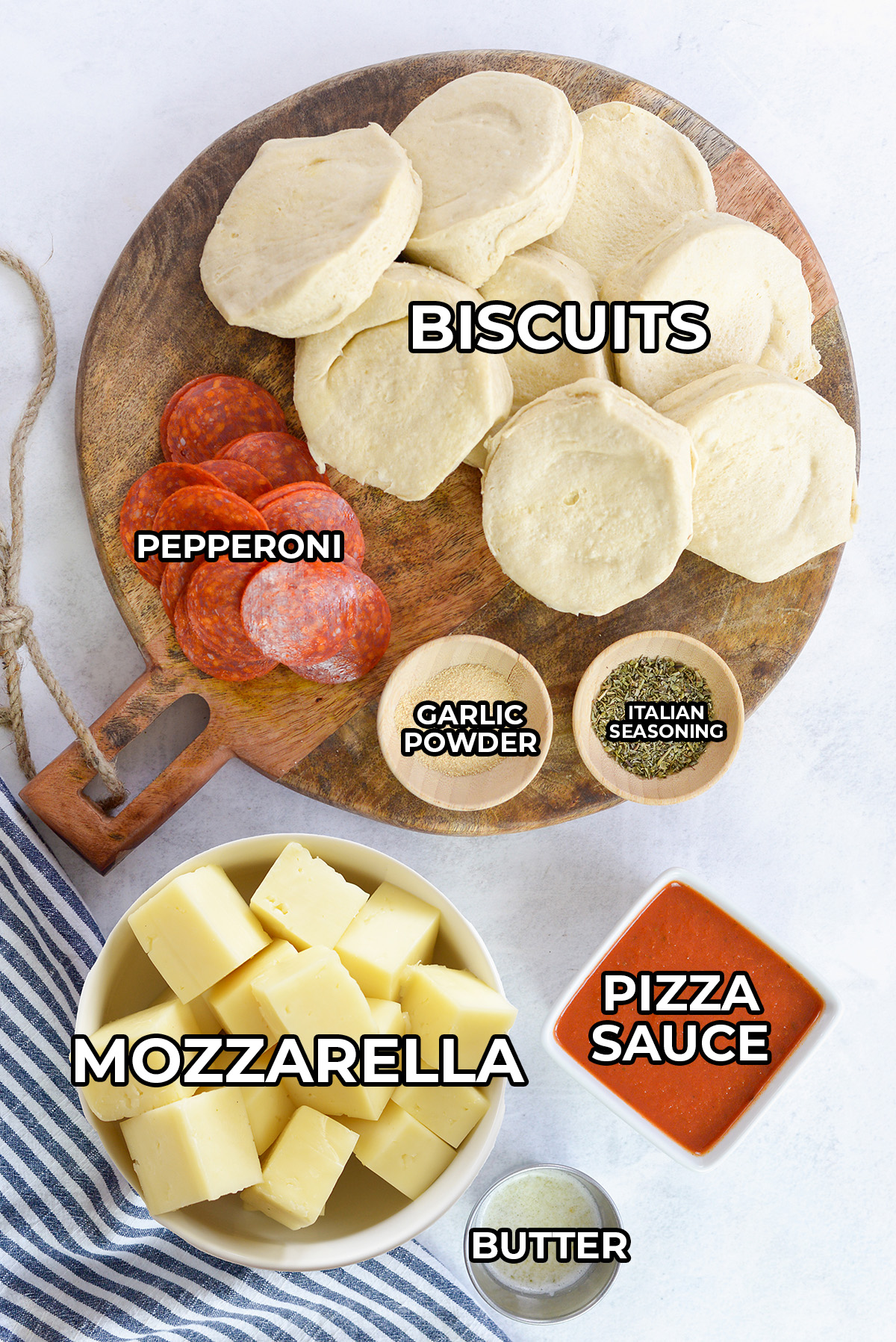 Ingredients for pizza bombs spread out on a counter.
