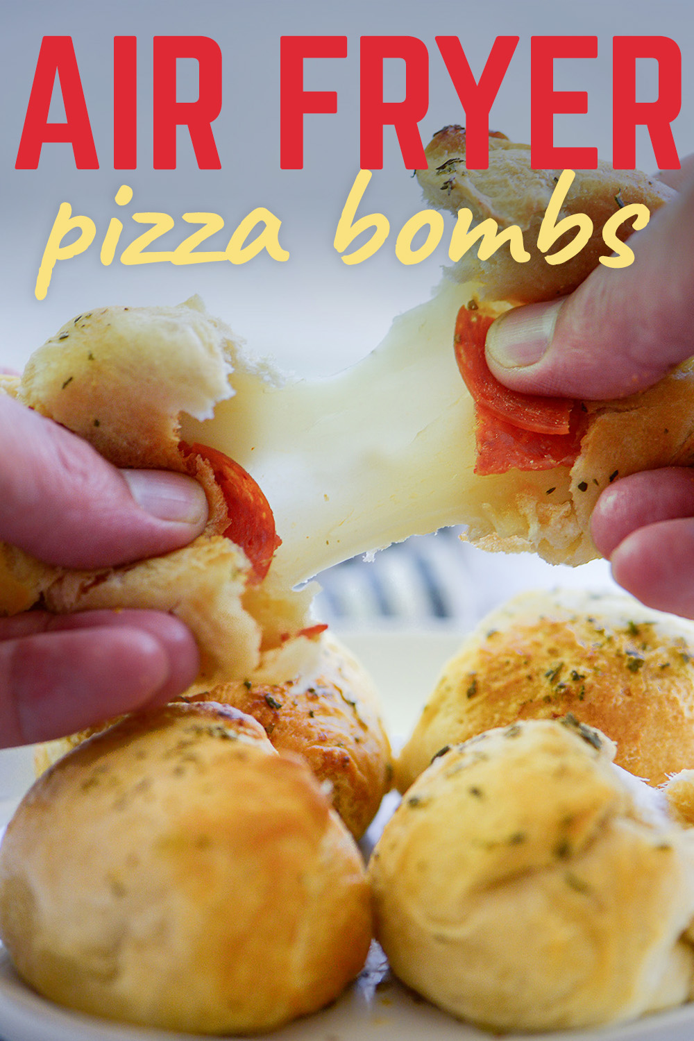 These soft, fluffy, filled little dough balls have a ton of cheese and pepperoni in them!  Be sure to try dipping these pizza bombs in some pizza sauce for the perfect appetizer!