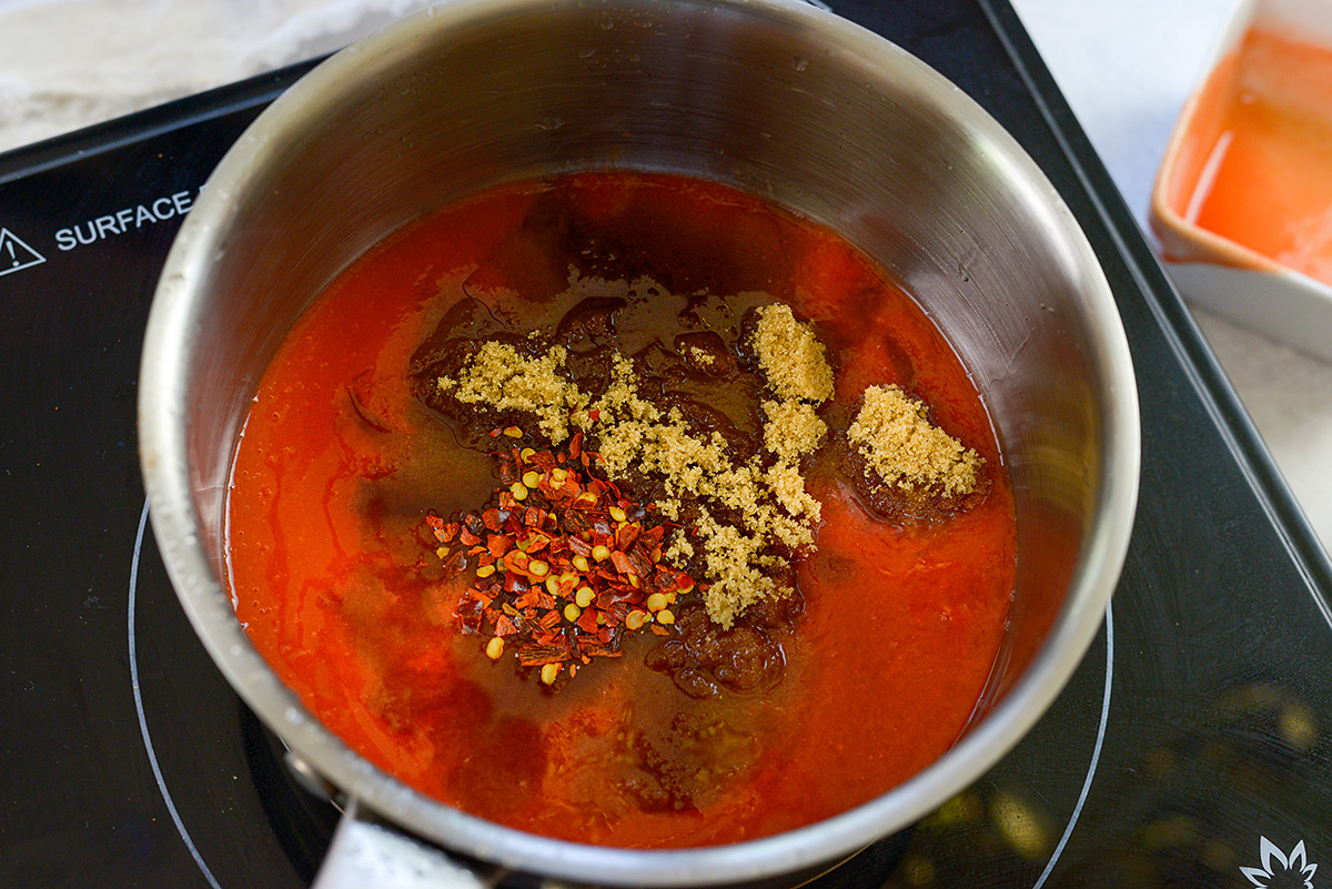 Fiirecracker sauce cooking in a saucepan.