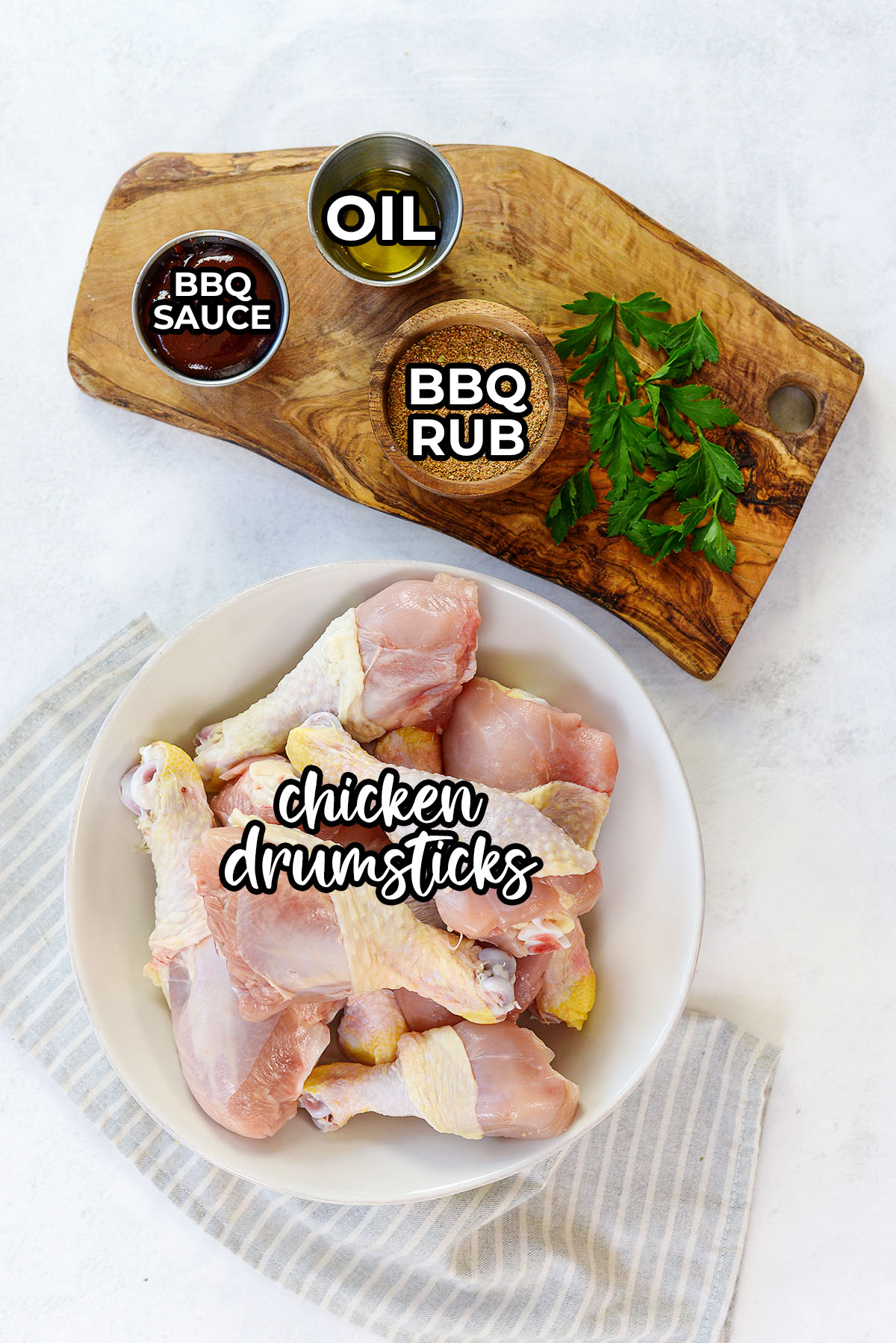 BBQ chicken leg ingredients spread out on a countertop.