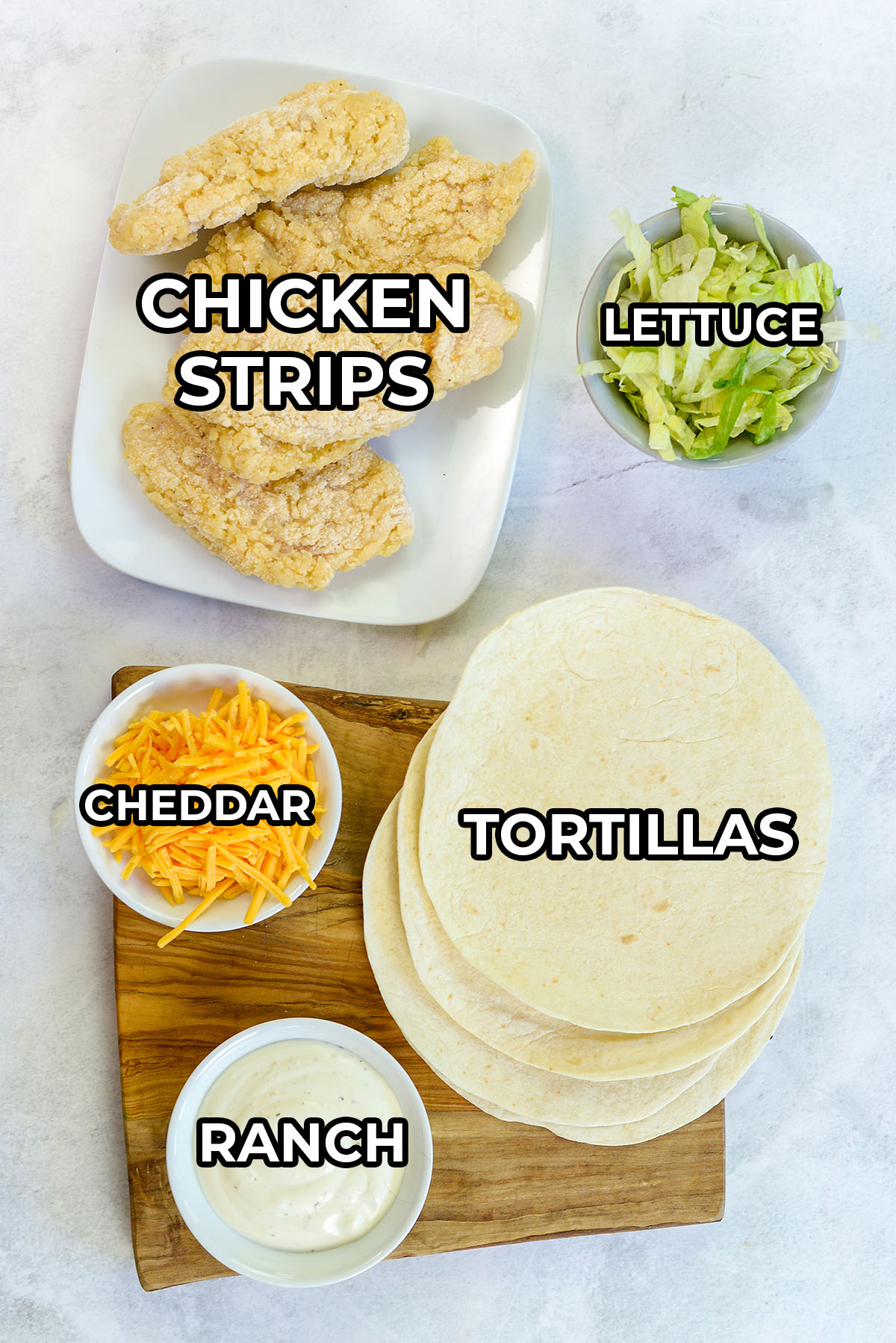 Ingredients for chicken snack wraps spread out on a countertop.