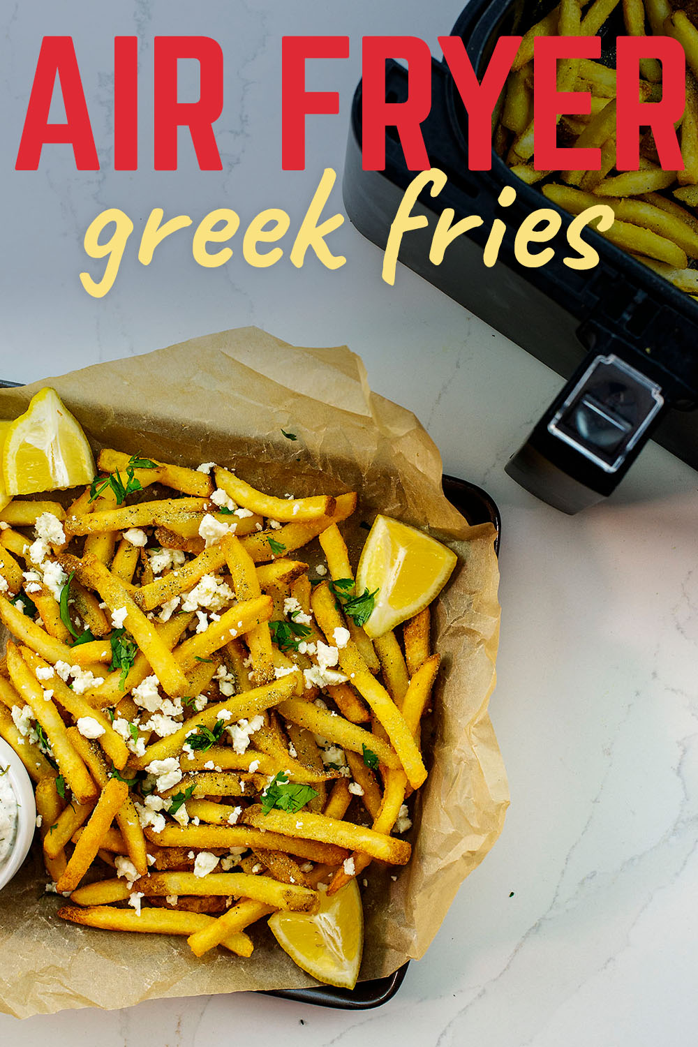 These air fried fries are packed with Greek flavors and then I dipped them in tzatziki sauce!