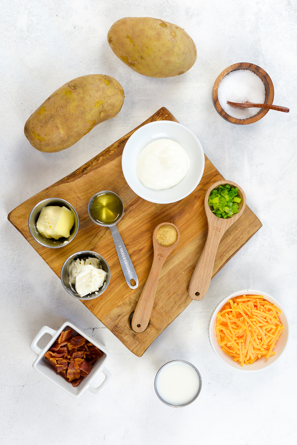 Twice baked potato ingredients on a countertop.