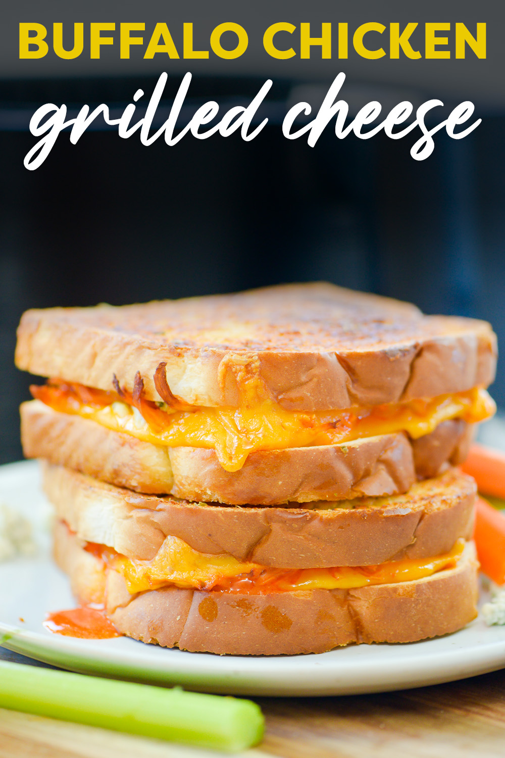 Two buffalo chicken grilled cheese sandwiches stacked up.