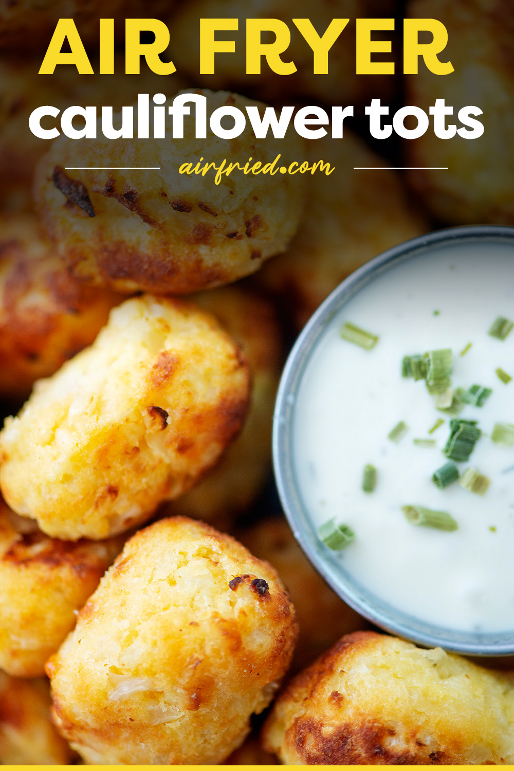 Close up of cauliflower tots next to ranch dressing.