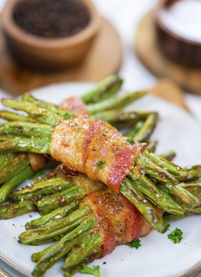 Close up of a few bundles of bacon wrapped green beans.