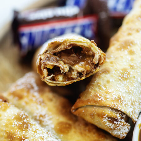 Close up of a split open snickers egg roll.