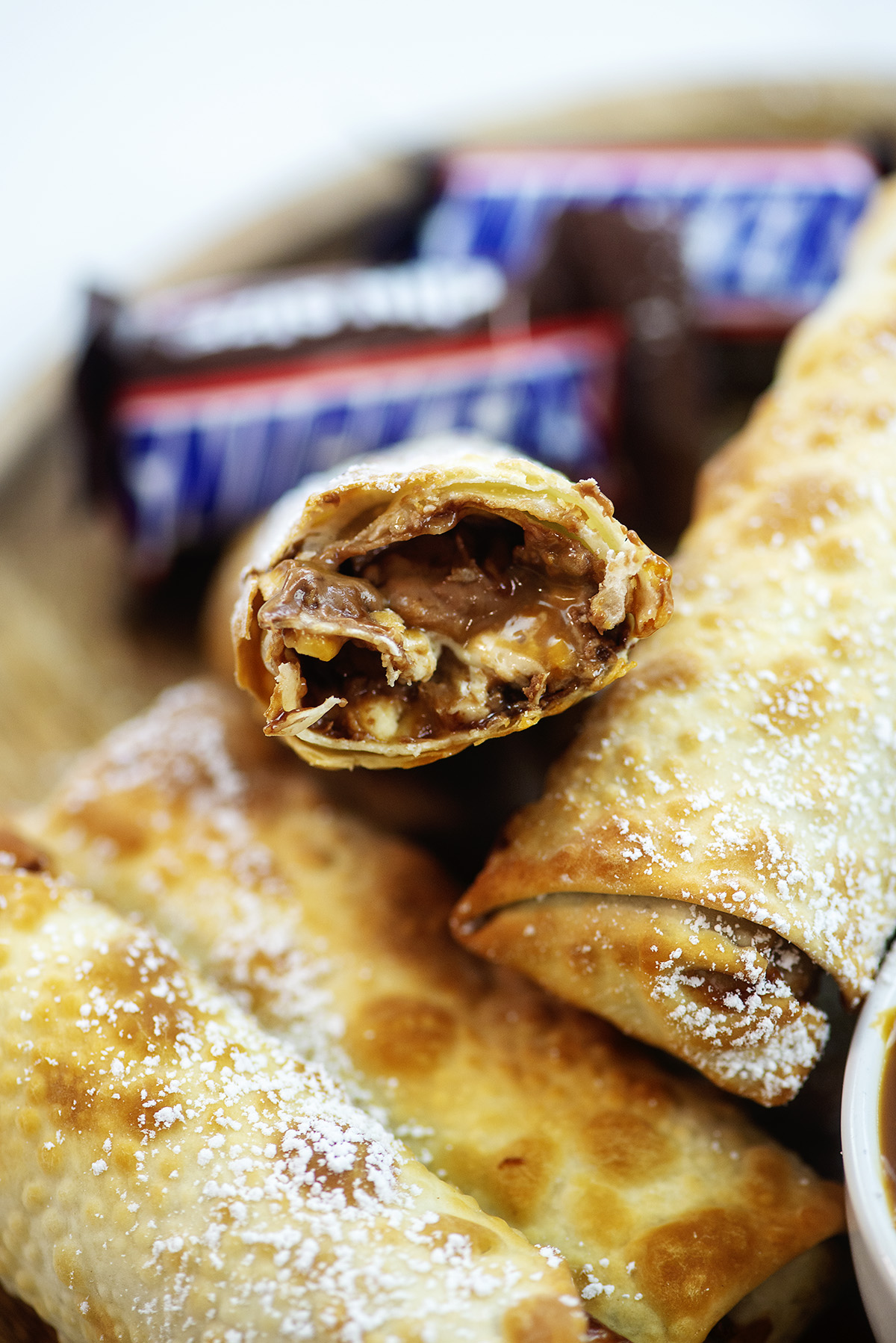Close up of a split open snickers egg roll.