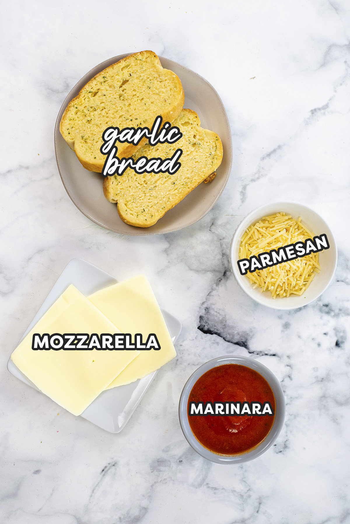 The ingredients for garlic bread grilled cheese on a white countertop.
