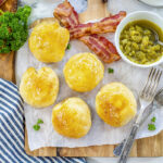 Breakfast bites on a cutting board with bacon.