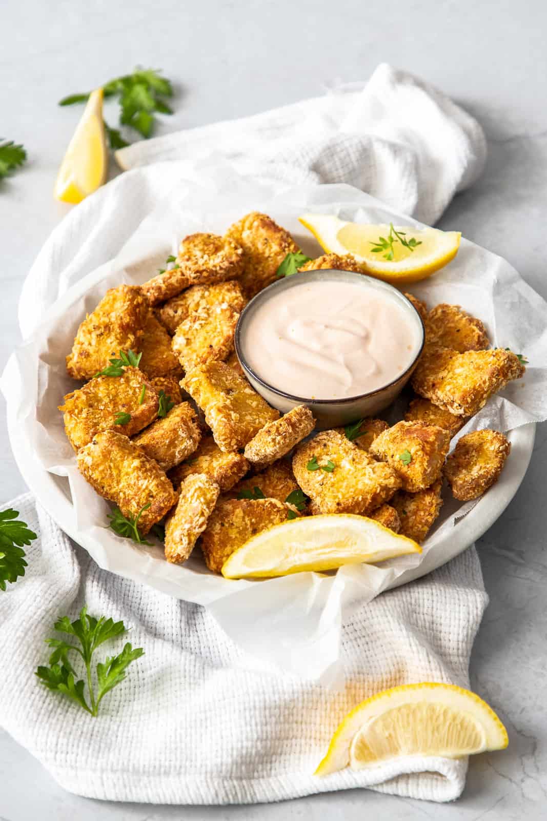 Tofu nuggets in a bowl with dip.